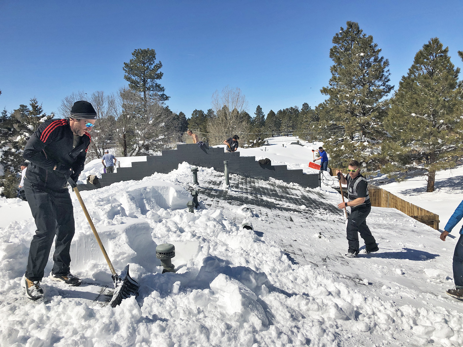 Roof top snow removal from homes in Flagstaff Arizona
